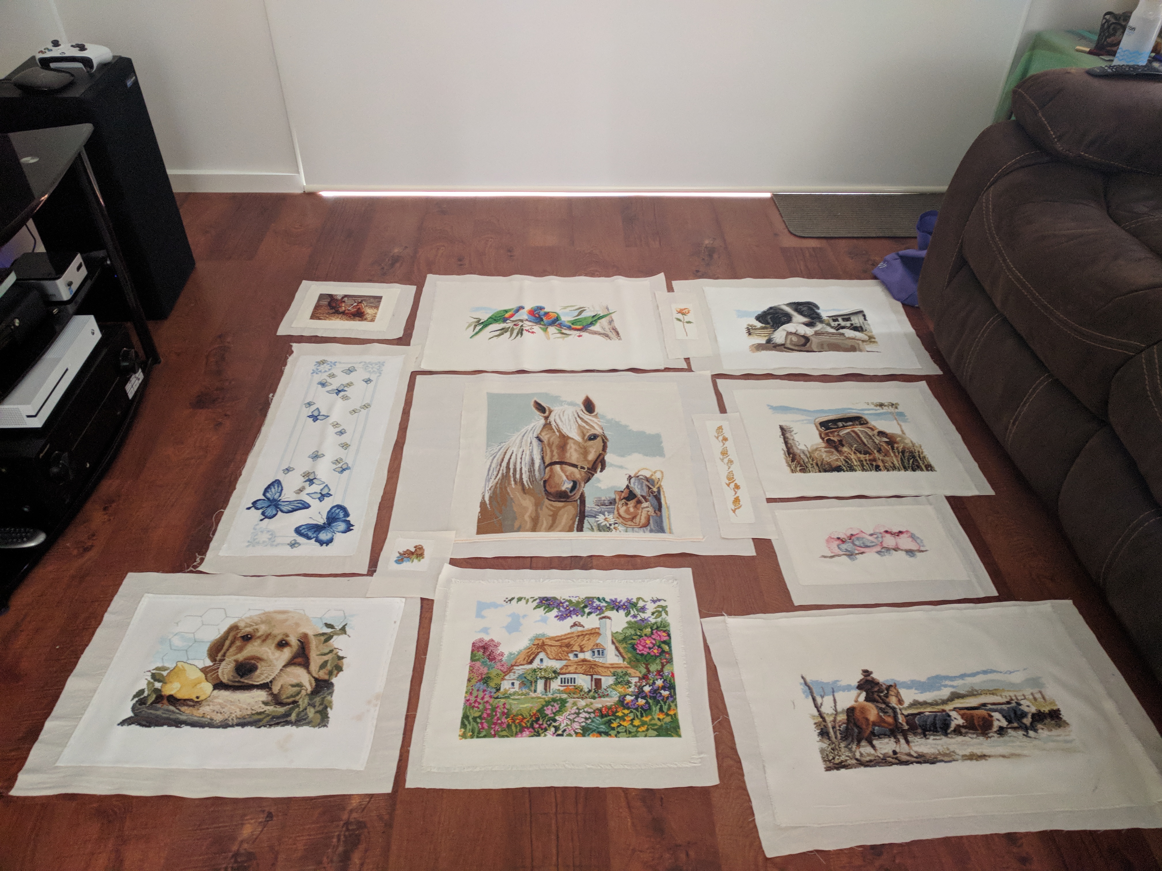Quilt lay out option 1. Row 1 - left to right: Mare and foal, lorikeets, rose and border collie. Row 2 - left to right: Butterflies, small cat, Palamino horse, wheat, rusty old car and galahs. Row 3 - left to right: Labrador puppy with chick, English cottage, droving cattle across a creek.